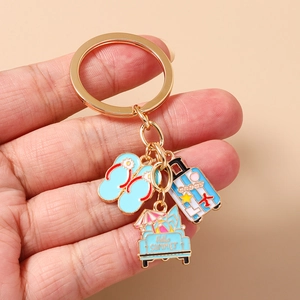 Detailed shot of summer beach keychain featuring travel luggage and ocean flip-flops charm