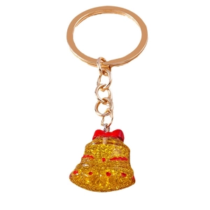 Christmas bell keychain with golden glitter, red bow detail and polished metal ring