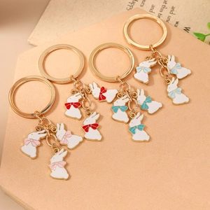 Lot de 4 porte-clés lapin en émail blanc avec nœuds colorés et anneaux dorés