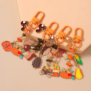 Enamel autumn keychain set with pumpkin, squirrel and mushroom charms for bags