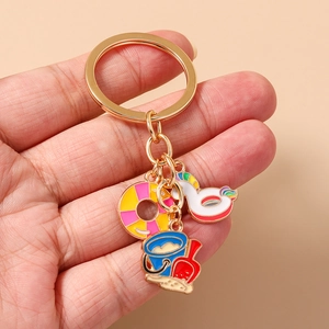 Detailed view of beach themed keychain with colorful lifebuoy and bucket charms