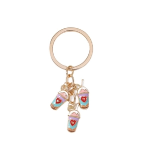 Colorful bubble tea keychain with red heart charms and golden ring on white background