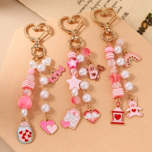 Pink beaded star and bear keychain with 1314 heart charm and golden hook for bags