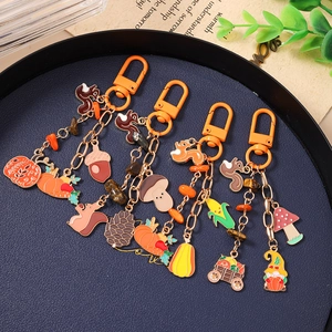 Autumn themed enamel keychain set with squirrel pumpkin mushroom and pinecone charms