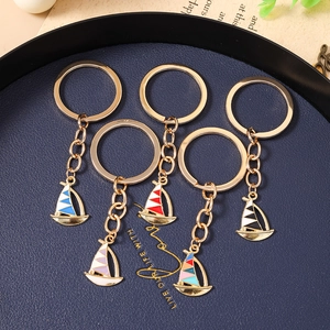 Set of 5 colorful enamel sailboat keychains with gold polished metal finish and rings