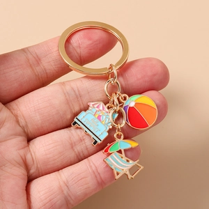 Detail of Hello Summer keychain featuring colorful beach car and ball enamel pendants