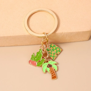 Detail of beach keychain with cactus, tropical shorts and coconut tree charms