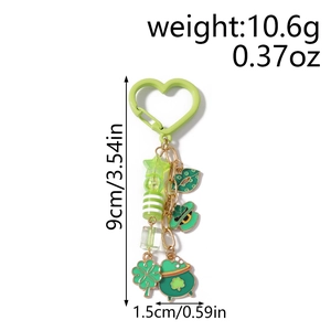 Detailed view of St. Patrick's Day keychain with clover charms and measurement labels