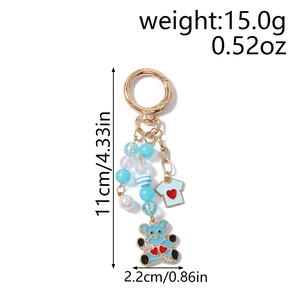 Dimensions du porte-clés ours bleu avec 11 cm de hauteur et 2,2 cm de largeur sur blanc