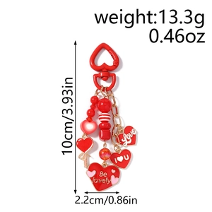 Detail of red heart keychain with Love letter beads and golden heart spring hook