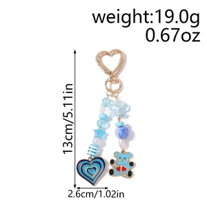 Blue beaded bear keychain with dimensions 13cm length showing heart pendant and bow details