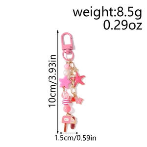 Pink star and starfish keychain detail showing dimensions of 10cm and 8.5g weight