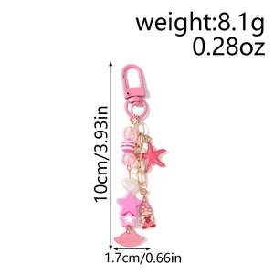 Detailed view of pink beaded keychain with starfish, heart and Kiss Me lip charms