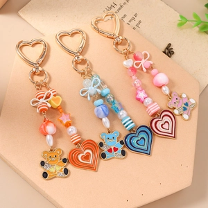 Beaded heart and bear keychains with golden spring clasps in macaron colors