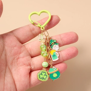 Macro detail of St Patrick's Day keychain with green shamrocks and beaded charms