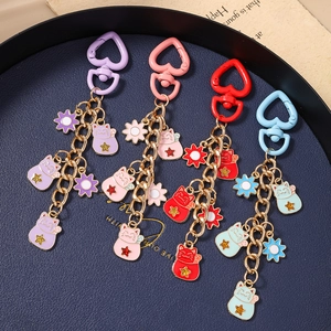 Lucky cat keychain set with heart buckle and colorful flower charms in four colors