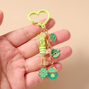 Detail of St. Patrick's Day keychain featuring green lucky hat and horseshoe charms