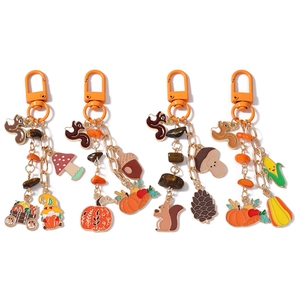 Autumn themed squirrel and pumpkin charms keychain set with colorful enamel finish
