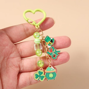 Detail of St. Patrick's Day keychain with green beads, lucky hat, and shamrock charms
