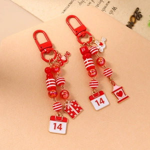 Valentine's Day love themed keychain with red and white striped beads and heart charm