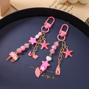 Pink starfish and star beaded keychain bag charms with heart and KISS ME lip pendants