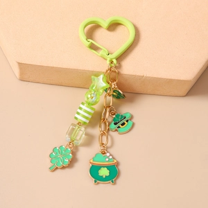 Detail of St. Patrick's Day keychain with green shamrock, top hat and gold pot charms