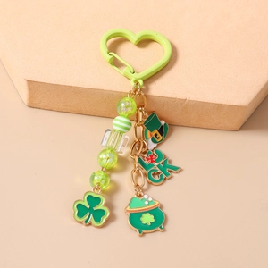 Detail of St. Patrick's Day keychain with green beads, lucky clover, and hat charms