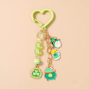 Detail of St. Patrick's Day keychain with clover, beer mug and gnome charms