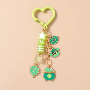Macro view of St. Patrick's Day keychain with green four-leaf clover and lucky hat charms