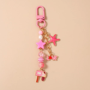 Detail of pink keychain with star, starfish charms, Mail box pendant and LOVE letters