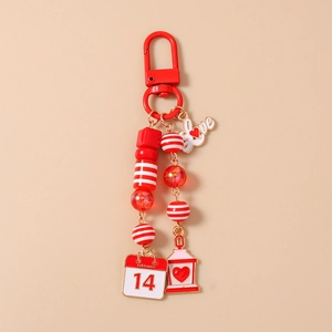 Detail of red Valentine's keychain with Love pendant and February 14th calendar tag