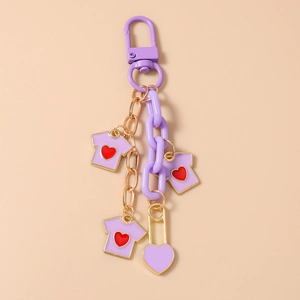 Detail view of purple chunky chain keychain with heart tee charms and metal clasp