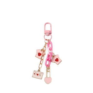 Pink heart keychain featuring acrylic chain, envelope charms, and small house pendants