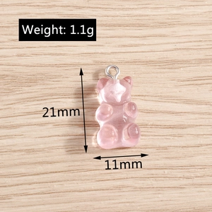 Detailed view of pink resin bear pendant with dimensions 21mm height and 11mm width