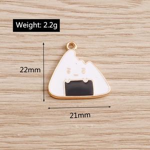 Detail view of cartoon rice ball enamel charm showing 22mm height and gold plating