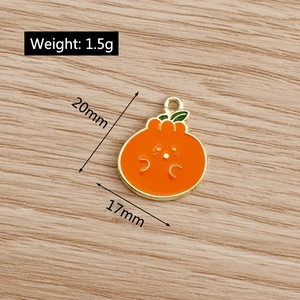 Detail of orange enamel fruit pendant with weight 1.5g and size 20mm x 17mm