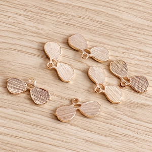 Golden alloy eyewear pendants with brushed texture and top ring for DIY jewelry making