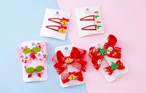 Detailed flat lay of festive Christmas hair clip set with snowman and resin charms
