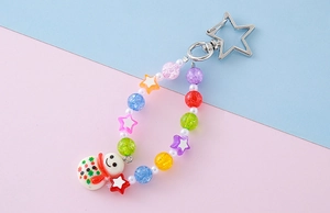 Detail of colorful beaded keychain featuring a cartoon snowman charm and star-shaped clasp