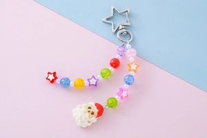 Detail of star-shaped clasp and colorful beaded chain with Santa Claus pendant