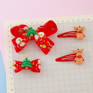Christmas hair clips set featuring red ribbon bows and cute reindeer holiday accessories