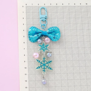 Blue sequin bow and snowflake charm keychain for bags with colorful pearlescent beads