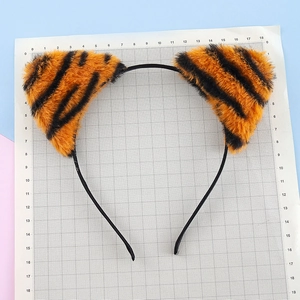 Cute plush tiger ears headband with orange animal print for cosplay and holiday party wear