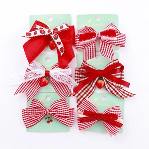 Lot de barrettes à nœuds rouge et blanc avec pendentifs fraises et dentelle