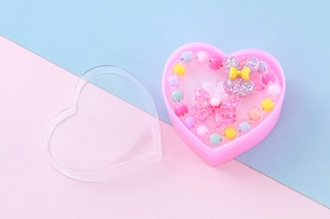 Kinderschmuck-Set mit Perlenarmband und Schleifenring in rosa Herz-Geschenkbox