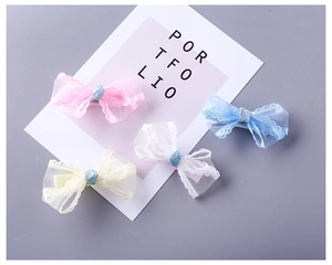 Detailed view of lightweight mesh lace bow hair clips in pink, blue, and white colors