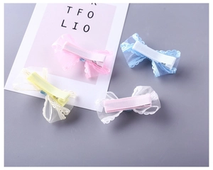 Detailed close-up of 4pcs pastel mesh bow hair clips with soft lace embroidery and duckbill base
