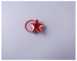 Detailed view of a red star-shaped hair tie with glossy PU leather and elastic band