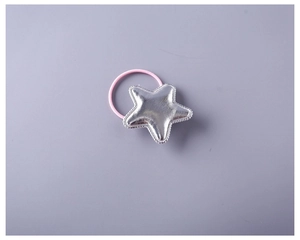 Close-up of a silver metallic PU star hair tie with a soft pink elastic band