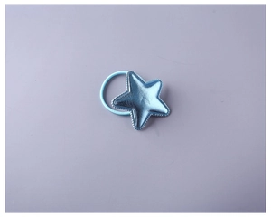 Close-up of blue PU star hair tie with metallic finish and embossed texture on band